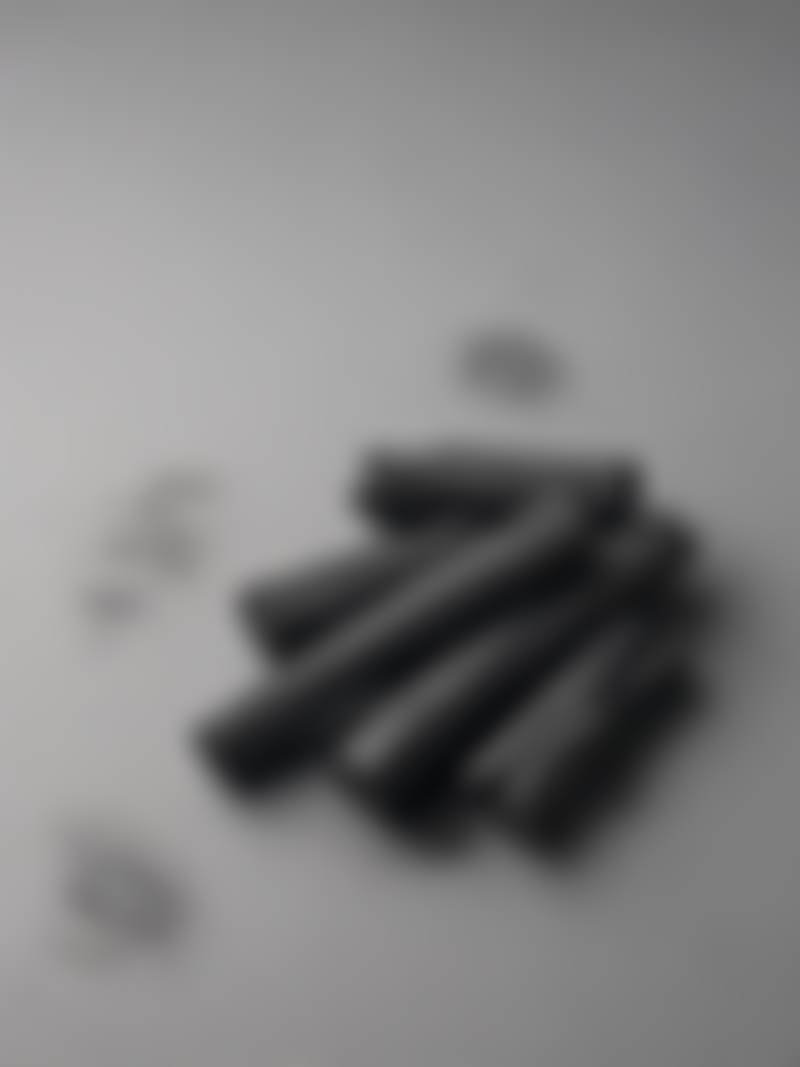Charcoal sticks on a studio table.